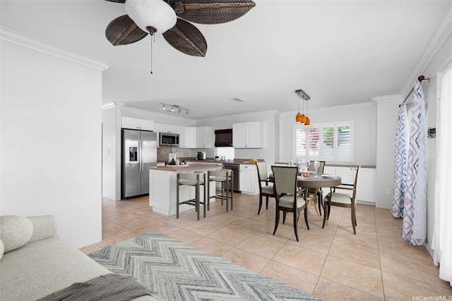 91-2141 Kaiwawalo St, Ewa Beach, HI 96706 - dining space featuring light tile patterned floors, crown molding, a ceiling fan, and rail lighting