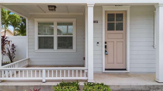 property entrance featuring a porch