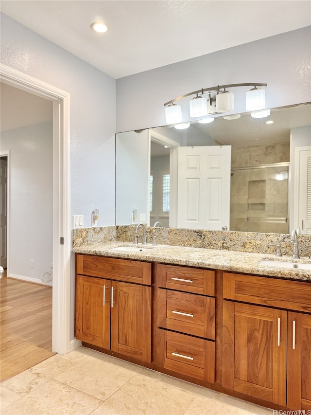 98-1810 Kaahumanu St Unit 3, Pearl City, HI 96782 - bathroom featuring double vanity, a stall shower, and a sink