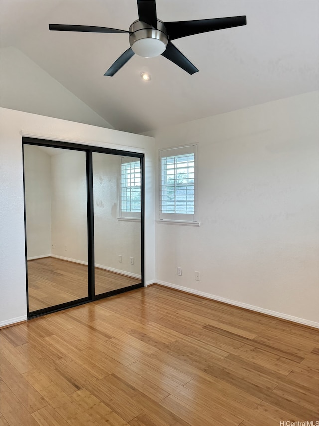 98-1810 Kaahumanu St Unit 3, Pearl City, HI 96782 - unfurnished bedroom with a closet, ceiling fan, light wood-style flooring, baseboards, and lofted ceiling