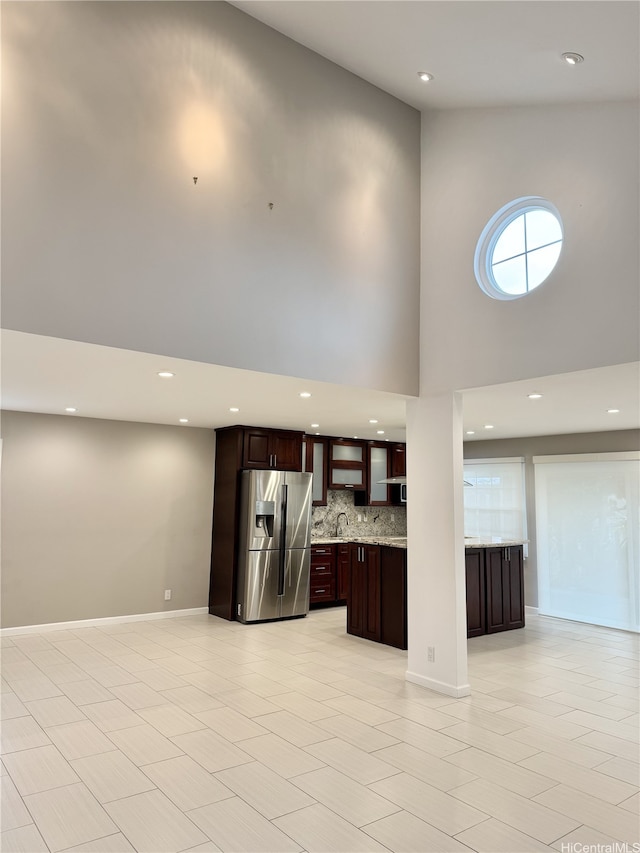 98-1810 Kaahumanu St Unit 3, Pearl City, HI 96782 - unfurnished living room with recessed lighting, a high ceiling, a sink, and baseboards