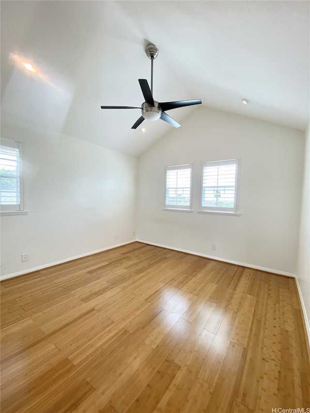98-1810 Kaahumanu St Unit 3, Pearl City, HI 96782 - unfurnished room featuring ceiling fan, baseboards, vaulted ceiling, and light wood-type flooring