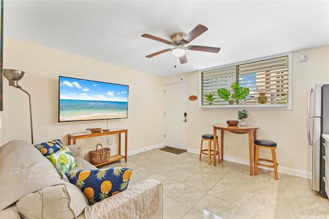 236 Liliuokalani Ave Unit 201, Honolulu, HI 96815 - living area featuring a ceiling fan and baseboards