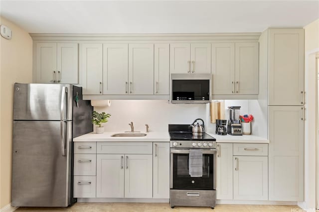 236 Liliuokalani Ave Unit 201, Honolulu, HI 96815 - kitchen with stainless steel appliances, light countertops, and cream cabinetry