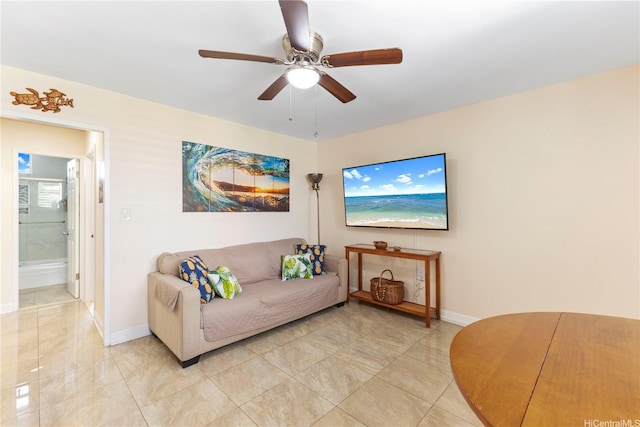 236 Liliuokalani Ave Unit 201, Honolulu, HI 96815 - living area featuring a ceiling fan and baseboards