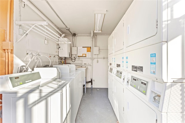 236 Liliuokalani Ave Unit 201, Honolulu, HI 96815 - communal laundry room with stacked washer / dryer, washer and clothes dryer, and water heater