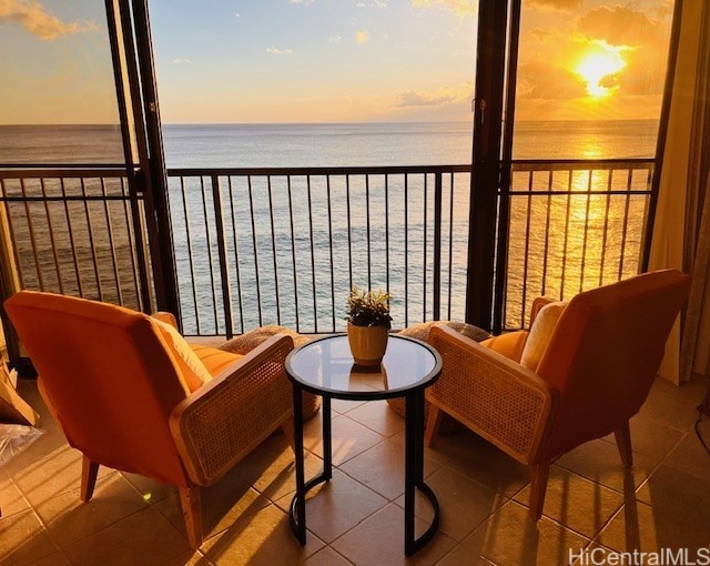 balcony featuring a water view