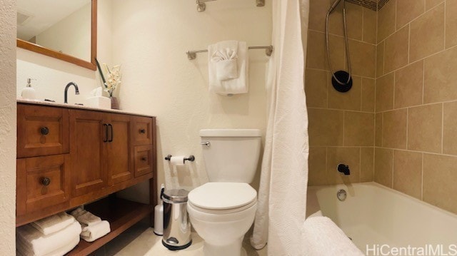 bathroom with shower / bath combination with curtain, toilet, and vanity