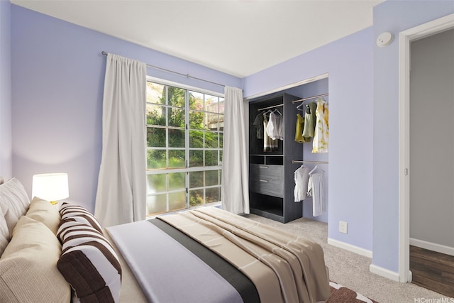 92-905 Hame Pl Unit 19-101, Kapolei, HI 96707 - bedroom featuring a closet, baseboards, and carpet floors
