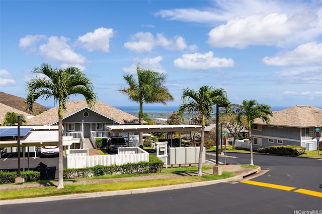 92-905 Hame Pl Unit 19-101, Kapolei, HI 96707 - view of building exterior with covered and uncovered parking