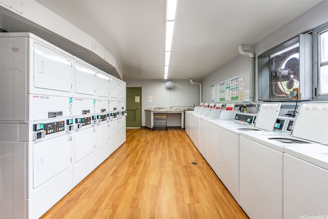 98-1038 Moanalua Rd Unit 1502, Aiea, HI 96701 - communal laundry room with stacked washing machine and dryer, washing machine and clothes dryer, and light wood-style flooring