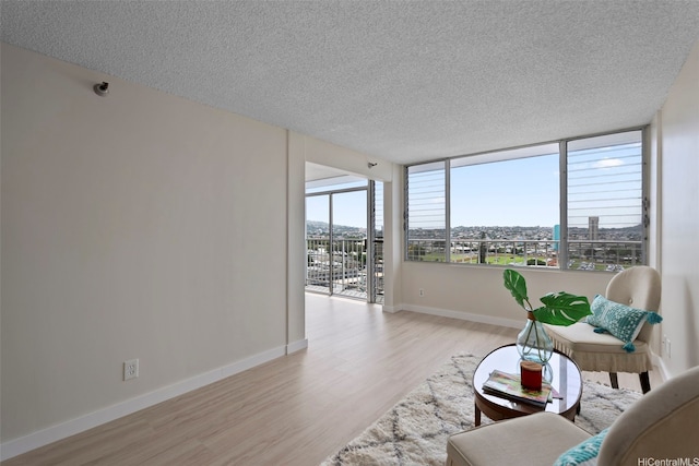 2542 Date St Unit 904, Honolulu, HI 96826 - interior space featuring baseboards, a textured ceiling, and wood finished floors
