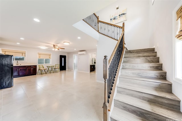 91-865 Ma Ke Kula St, Ewa Beach, HI 96706 - stairway featuring a wall mounted AC, ceiling fan, recessed lighting, and baseboards