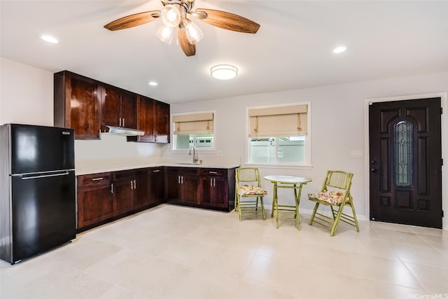 91-865 Ma Ke Kula St, Ewa Beach, HI 96706 - kitchen featuring freestanding refrigerator, under cabinet range hood, light countertops, a sink, and a ceiling fan