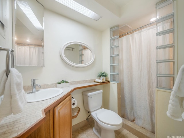 87-561 Farrington Hwy Unit 315, Waianae, HI 96792 - bathroom featuring toilet, vanity, tile patterned floors, and curtained shower