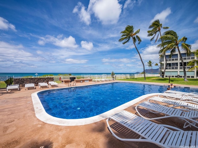 87-561 Farrington Hwy Unit 315, Waianae, HI 96792 - community pool with a patio, fence, and a water view