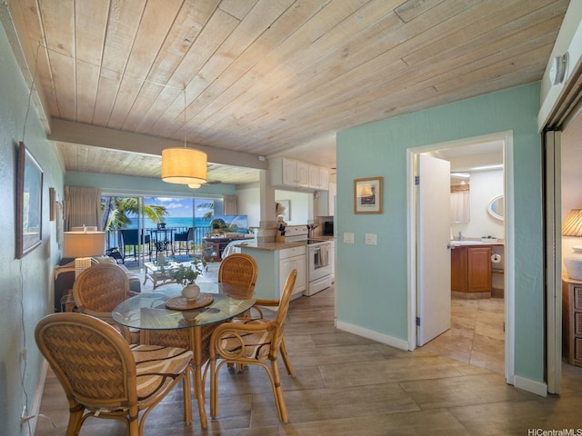 87-561 Farrington Hwy Unit 315, Waianae, HI 96792 - dining space with baseboards and wooden ceiling