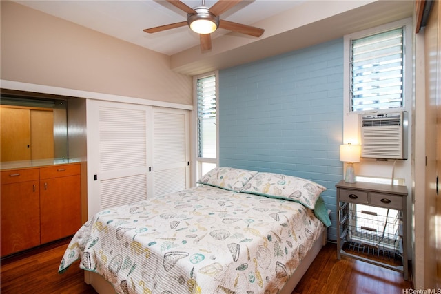 1020 Green St Unit Ph2, Honolulu, HI 96822 - bedroom featuring a ceiling fan, cooling unit, a closet, and dark wood-type flooring