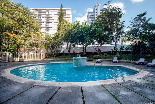 view of pool with a fenced in pool, a patio area, and fence