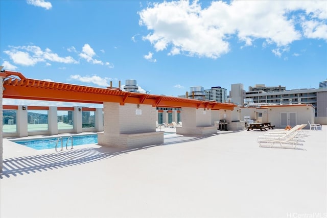 475 Atkinson Dr Unit 1806, Honolulu, HI 96814 - rear view of property with a patio, a community pool, and a pergola