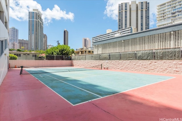 475 Atkinson Dr Unit 1806, Honolulu, HI 96814 - view of tennis court featuring fence and a city view