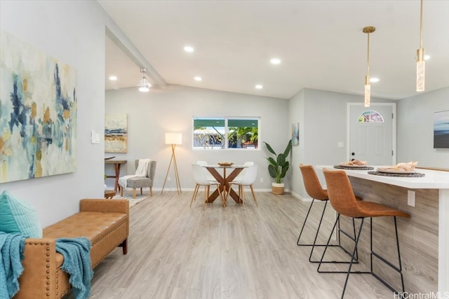 interior space with recessed lighting, baseboards, lofted ceiling, and light wood-style floors