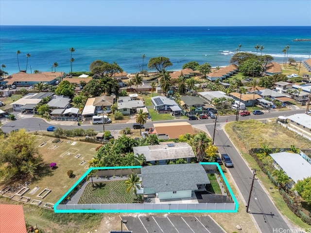 drone / aerial view featuring a water view and a residential view