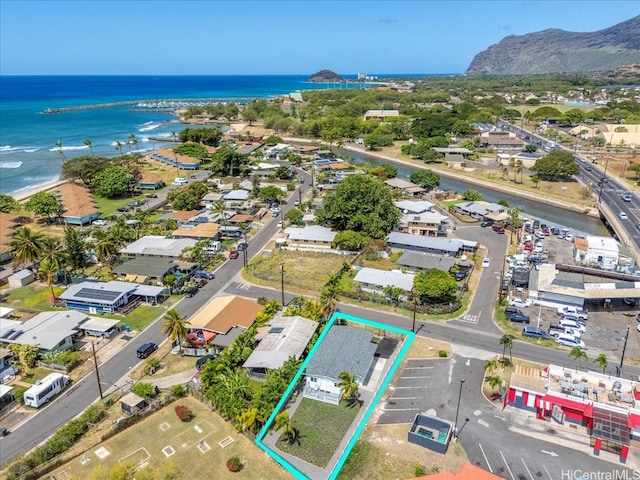 drone / aerial view with a residential view and a water and mountain view