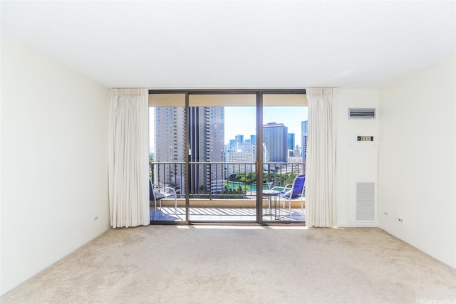 411 Hobron Ln Unit 1710, Honolulu, HI 96813 - empty room with carpet floors, a view of skyline, and expansive windows