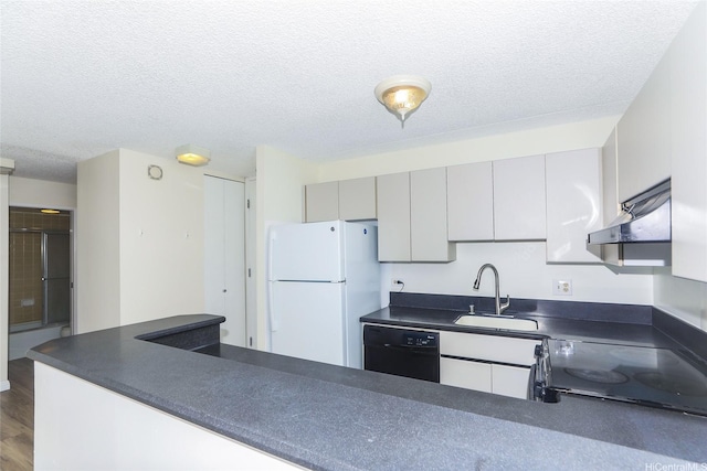 411 Hobron Ln Unit 1710, Honolulu, HI 96813 - kitchen featuring freestanding refrigerator, black dishwasher, extractor fan, dark countertops, and stove