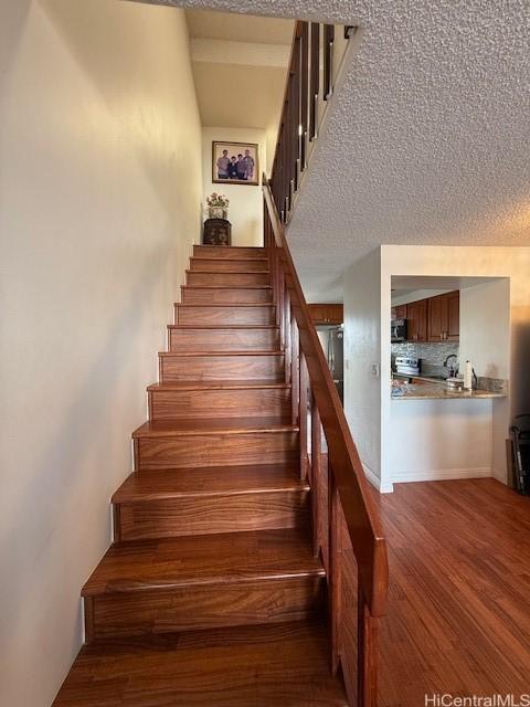 500 University Ave Unit 917, Honolulu, HI 96826 - staircase with wood finished floors