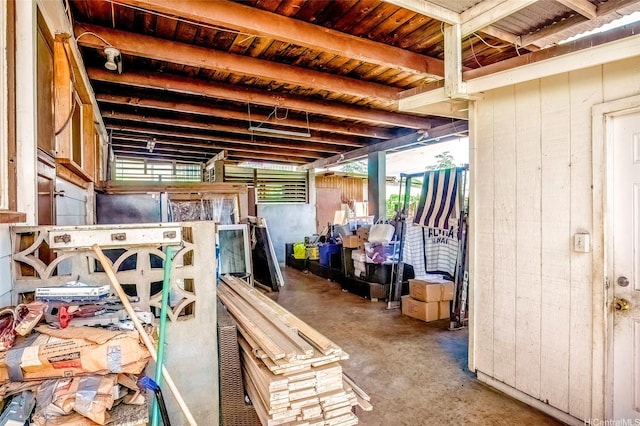 94-941 Awanei St, Waipahu, HI 96797 - misc room with wood walls, concrete floors, and a healthy amount of sunlight