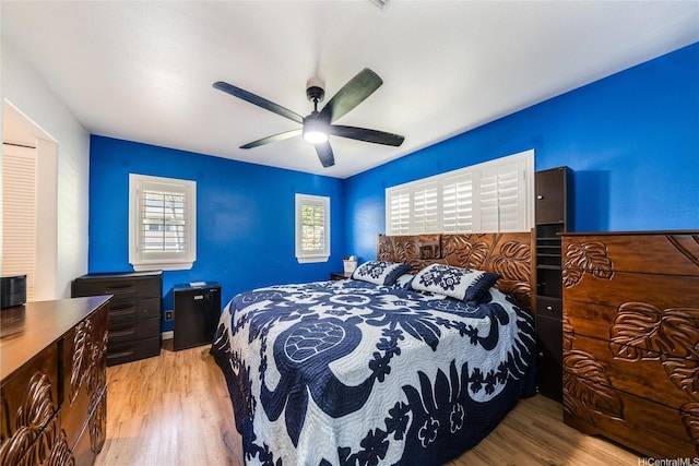 bedroom with wood finished floors and a ceiling fan