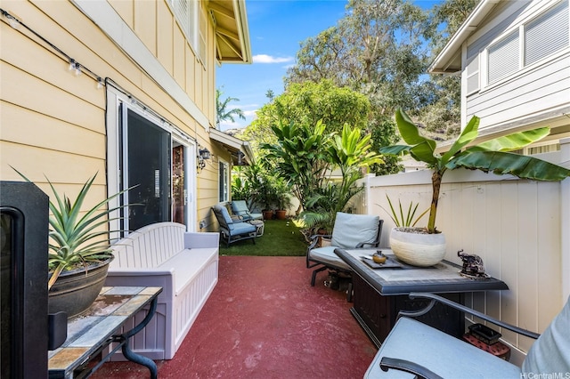 view of patio featuring fence