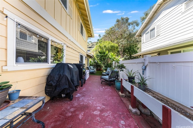 view of patio / terrace featuring fence