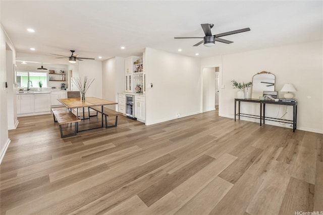 552 Kalolina St, Kailua, HI 96734 - living area with beverage cooler, ceiling fan, a bar, and light wood-style floors