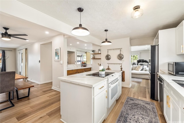 552 Kalolina St, Kailua, HI 96734 - kitchen featuring a center island, white cabinetry, and stainless steel appliances