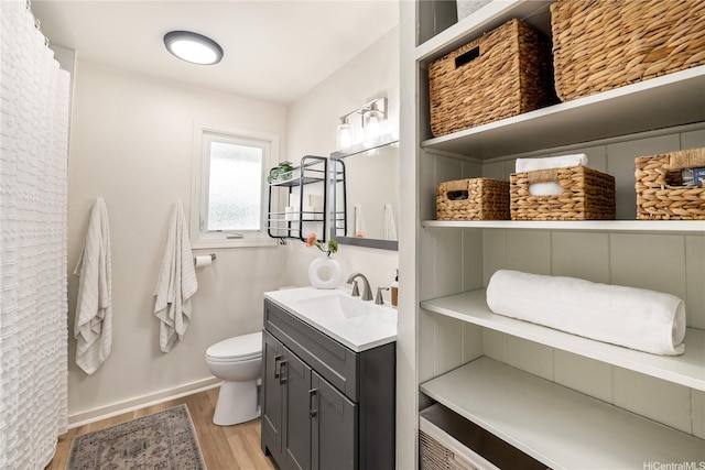 552 Kalolina St, Kailua, HI 96734 - full bathroom featuring vanity, baseboards, wood finished floors, and toilet