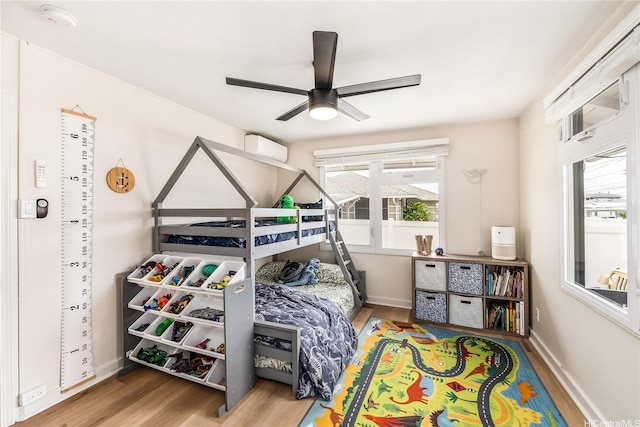 552 Kalolina St, Kailua, HI 96734 - bedroom with baseboards, ceiling fan, and wood finished floors