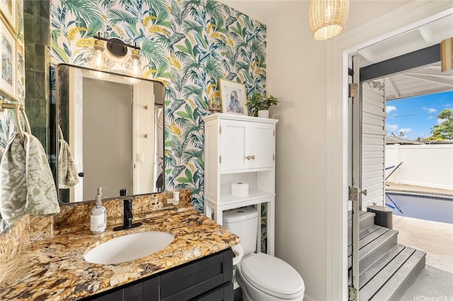 552 Kalolina St, Kailua, HI 96734 - full bathroom with toilet, wallpapered walls, and vanity