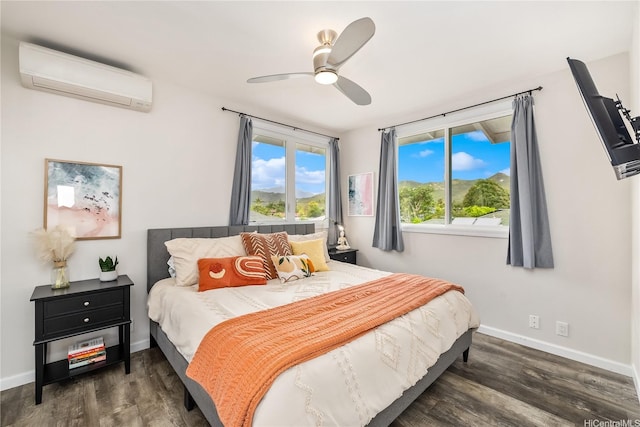 552 Kalolina St, Kailua, HI 96734 - bedroom featuring baseboards, ceiling fan, a wall mounted AC, and wood finished floors
