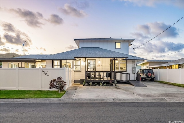 552 Kalolina St, Kailua, HI 96734 - view of front of home with a deck, fence, and roof with shingles