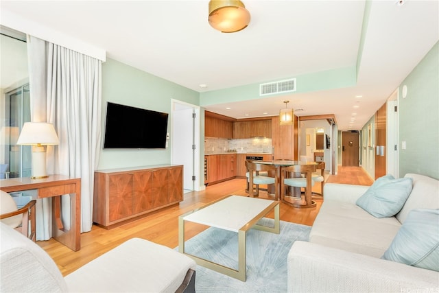 2139 Kuhio Ave Fl 34Th, Honolulu, HI 96815 - living area featuring light wood-style floors and visible vents