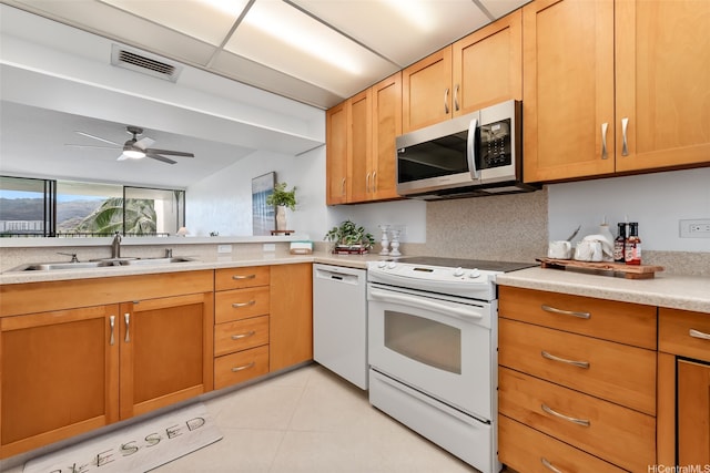 500 Lunalilo Home Rd Unit 25B, Honolulu, HI 96825 - kitchen featuring visible vents, white appliances, ceiling fan, light countertops, and a sink