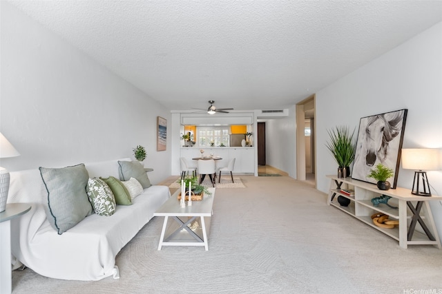 500 Lunalilo Home Rd Unit 25B, Honolulu, HI 96825 - living area featuring a textured ceiling, ceiling fan, visible vents, and light colored carpet