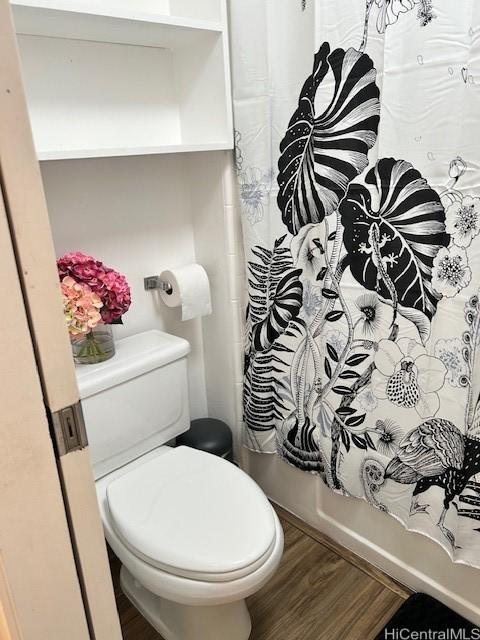 1620 Keeaumoku St Unit 404, Honolulu, HI 96822 - bathroom featuring toilet and wood finished floors