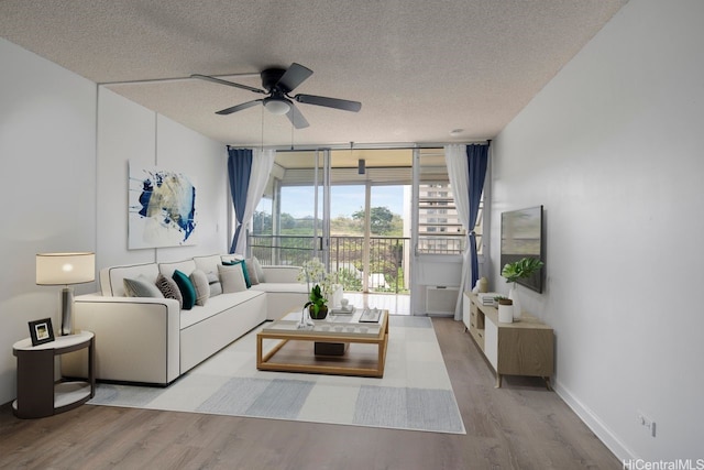 3161 Ala Ilima St Unit 811, Honolulu, HI 96818 - living room with a textured ceiling, wood finished floors, ceiling fan, and baseboards