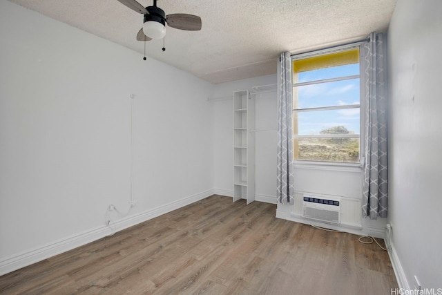 3161 Ala Ilima St Unit 811, Honolulu, HI 96818 - unfurnished room with wood finished floors, a ceiling fan, a textured ceiling, and baseboards