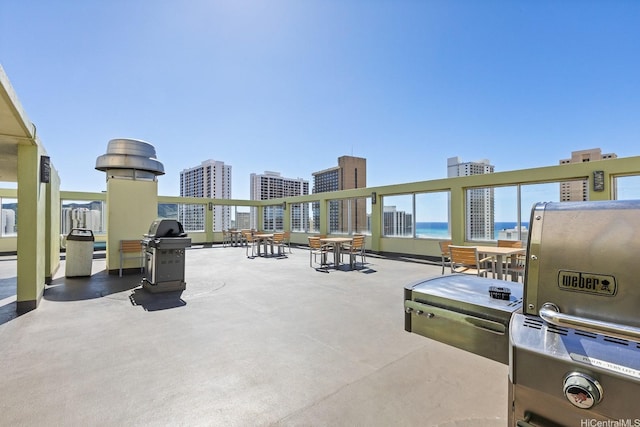 2452 Tusitala St Unit 908, Honolulu, HI 96815 - view of patio with a city view and a grill