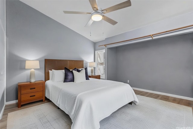 95-100 Moenamanu St Unit 458, Mililani, HI 96789 - bedroom with wood finished floors, baseboards, vaulted ceiling, and ceiling fan